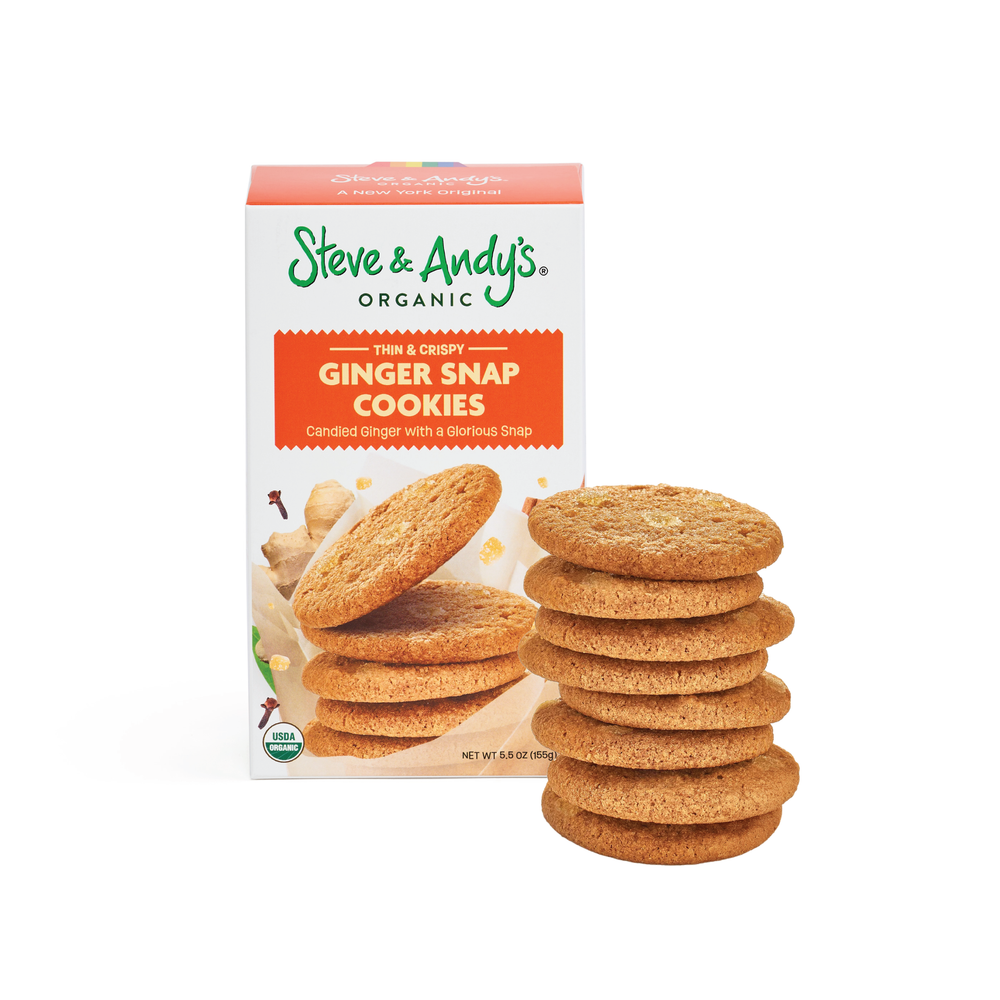 A stack of ginger snap cookies in front of a box labeled 'Steve & Andy's Organic Ginger Snap Cookies.