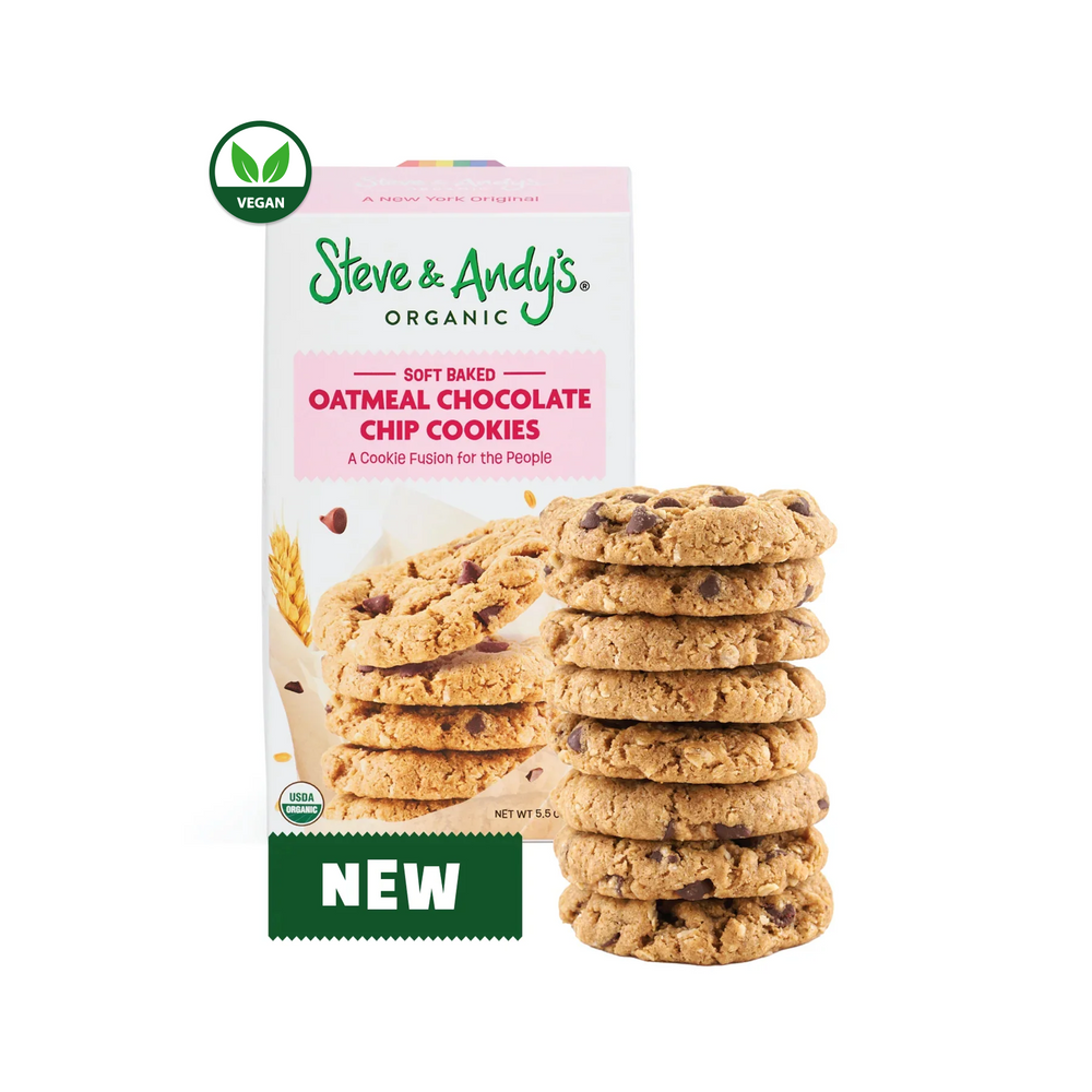 Packaging of Steve & Andy's Organic Oatmeal Chocolate Chip Cookies with the cookies displayed in front of the box. The packaging has the 'new' label and indicates the product is vegan.